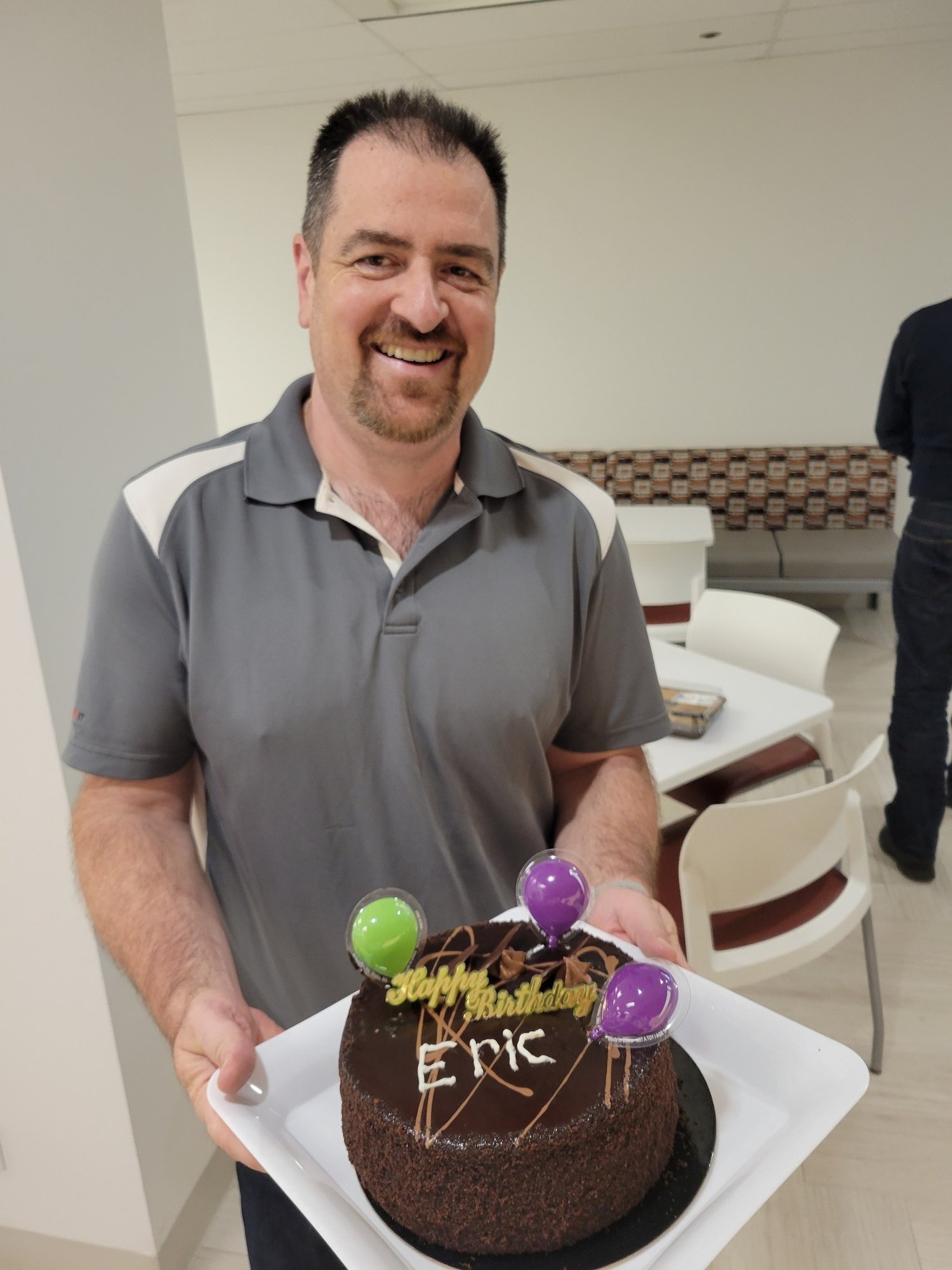 Eric Sugar, President at ProServeIT with a birthday cake