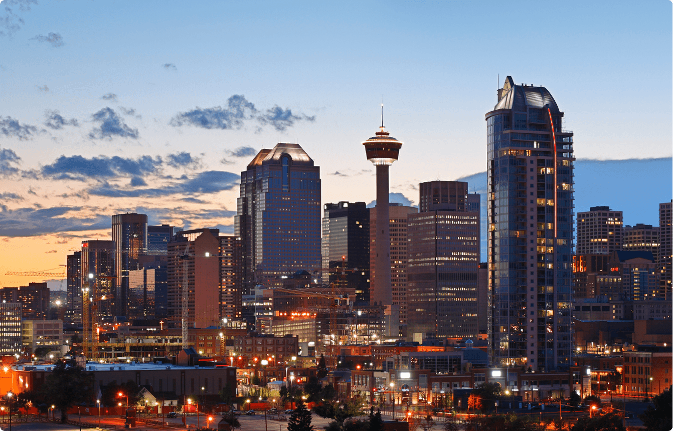 Calgary skyline with the Calgary Tower and surrounding downtown buildings at dusk, representing the location of the AI Copilot EBS event.