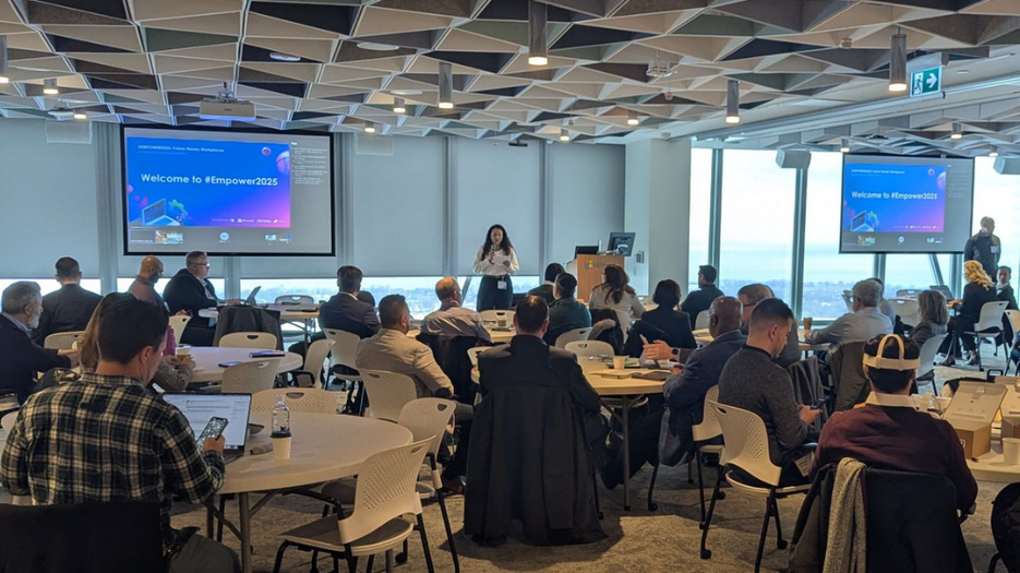 Empower 2025 Event attendees gathered for a keynote presentation in a conference room
