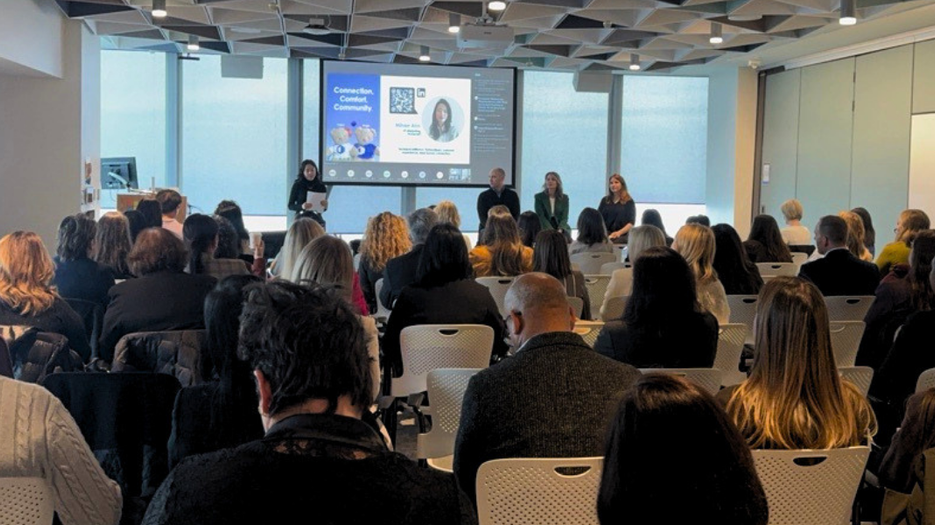 EmpowerWomen 2026 - attendees seated in a conference room during a panel discussion and presentation session