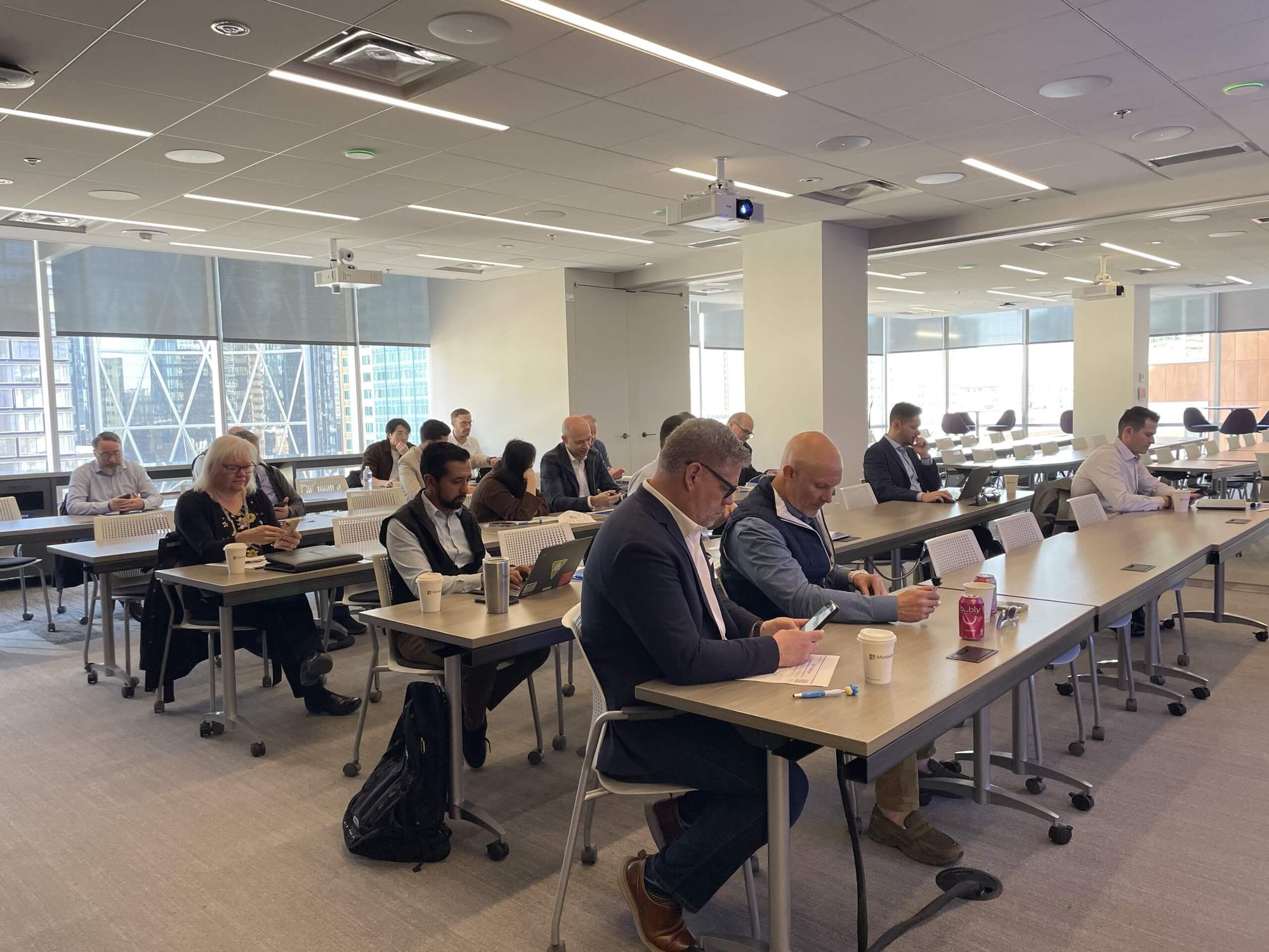 Full room of attendees at the ProServeIT AI copilot executive briefing session at Microsoft office in Calgary
