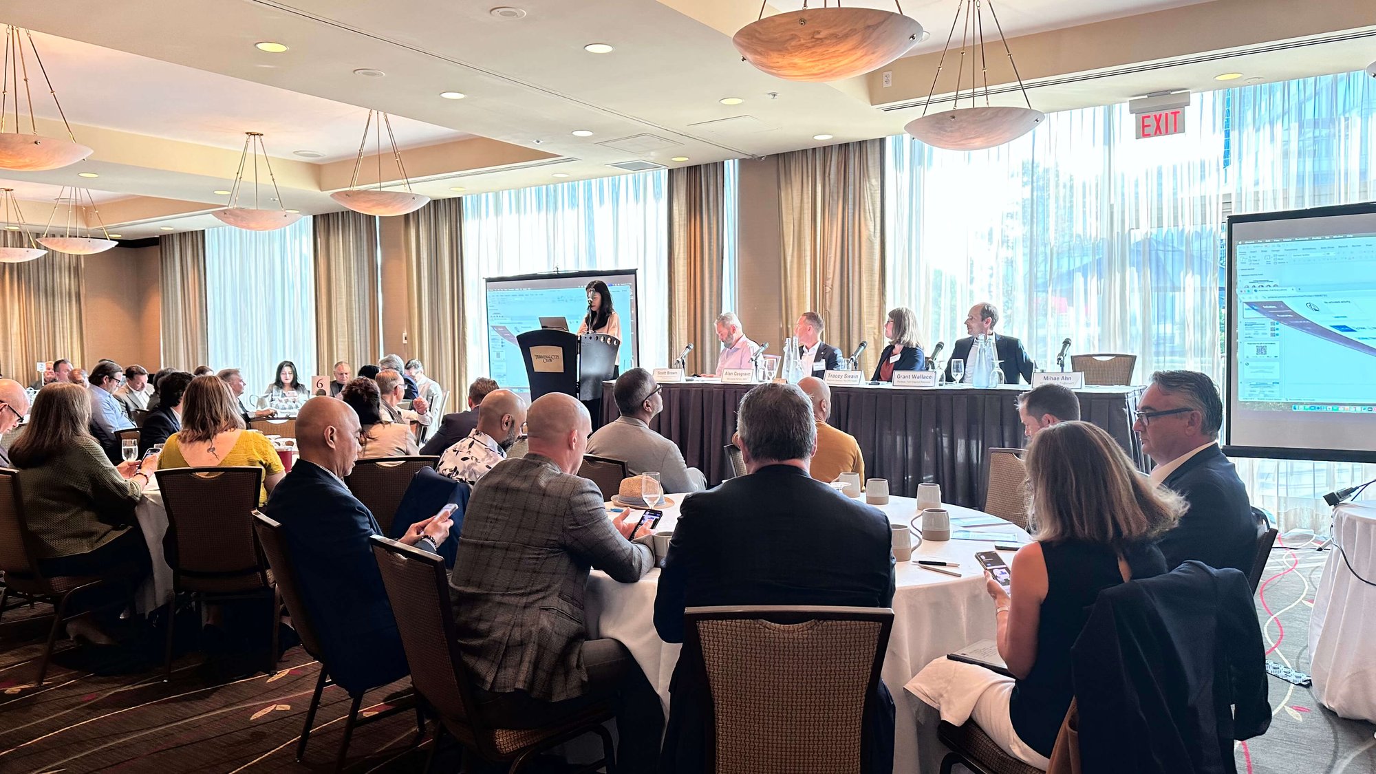 Executive breakfast event hosted by ProServeIT with attendees participating in a panel discussion on profitable growth strategies and business transformation.