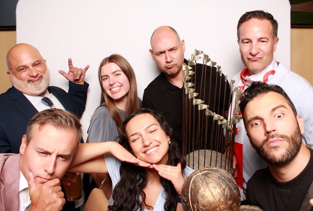 ProServeIT sales team at an event taking a photos as a photobooth