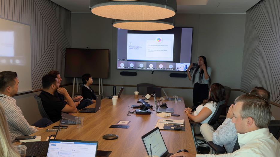 Promptathon Event 1 with attendees participating in an AI prompting workshop and presentation session