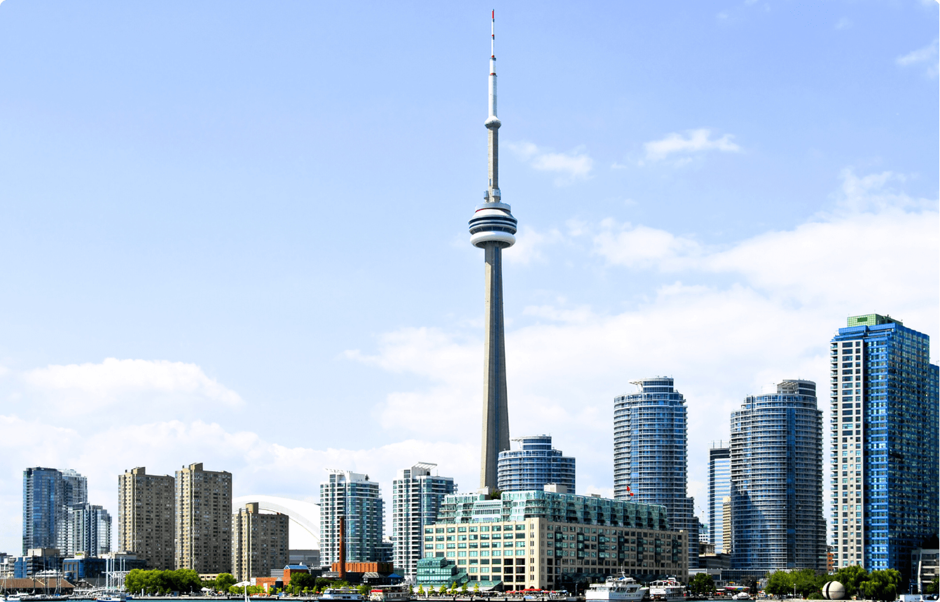 Toronto skyline with the CN Tower and surrounding downtown buildings under a clear blue sky, representing the location of the ProServeIT AI Copilot EBS event.