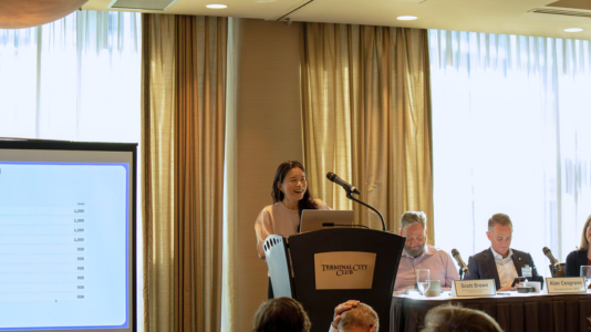A ProServeIT employee at the Terminal City Club presenting at a breakfast event for leaders
