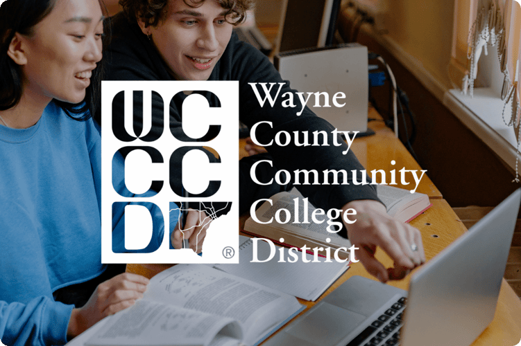 Students studying together with a laptop at Wayne County Community College District, highlighting digital learning and Microsoft 365 collaboration