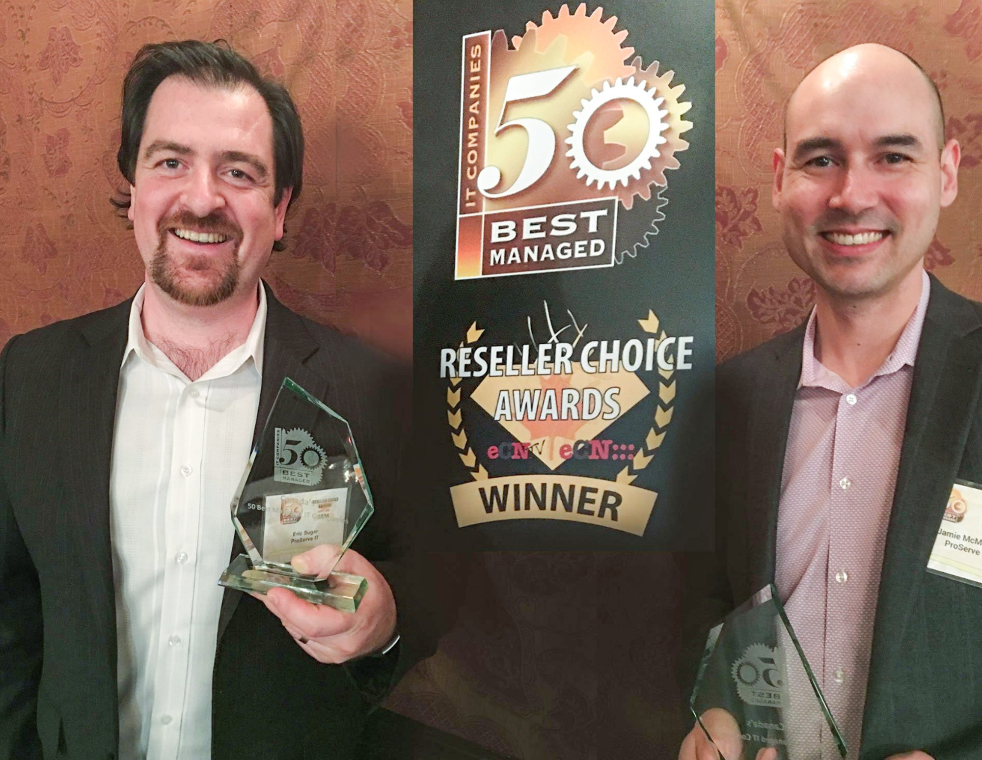 Eric Sugar, ProServeIT's president, and Jaime McMahon, ProServeIT's CTO, pictured holding an award for 50 best managed services IT companies