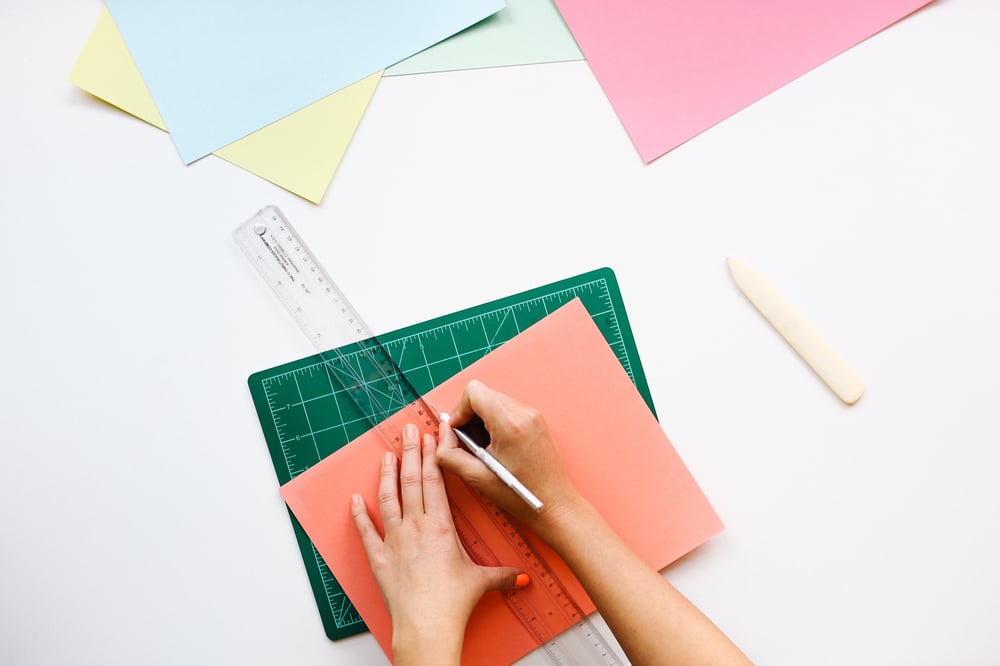 person cutting paper